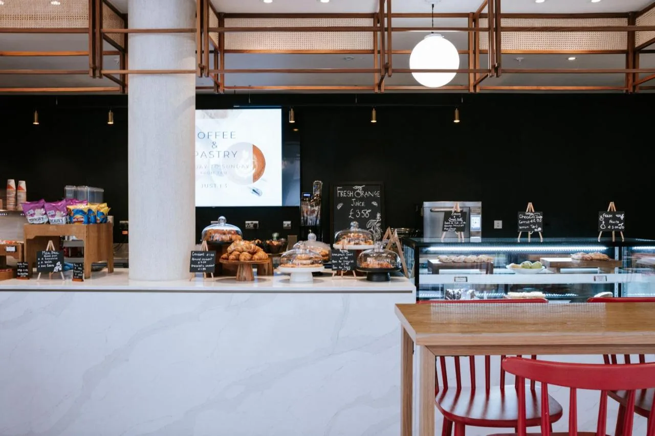 Bakery counter with cakes and pastries at breakfast